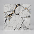 A square marble-look tile or slab with a white base and dramatic black veining, accented by metallic gold veining. The number '490010' is printed in orange at the top.