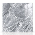 A square gray marble-look tile or slab with white and darker gray veining, shown against a tan textured background. The number '660011' appears in black at the top left.