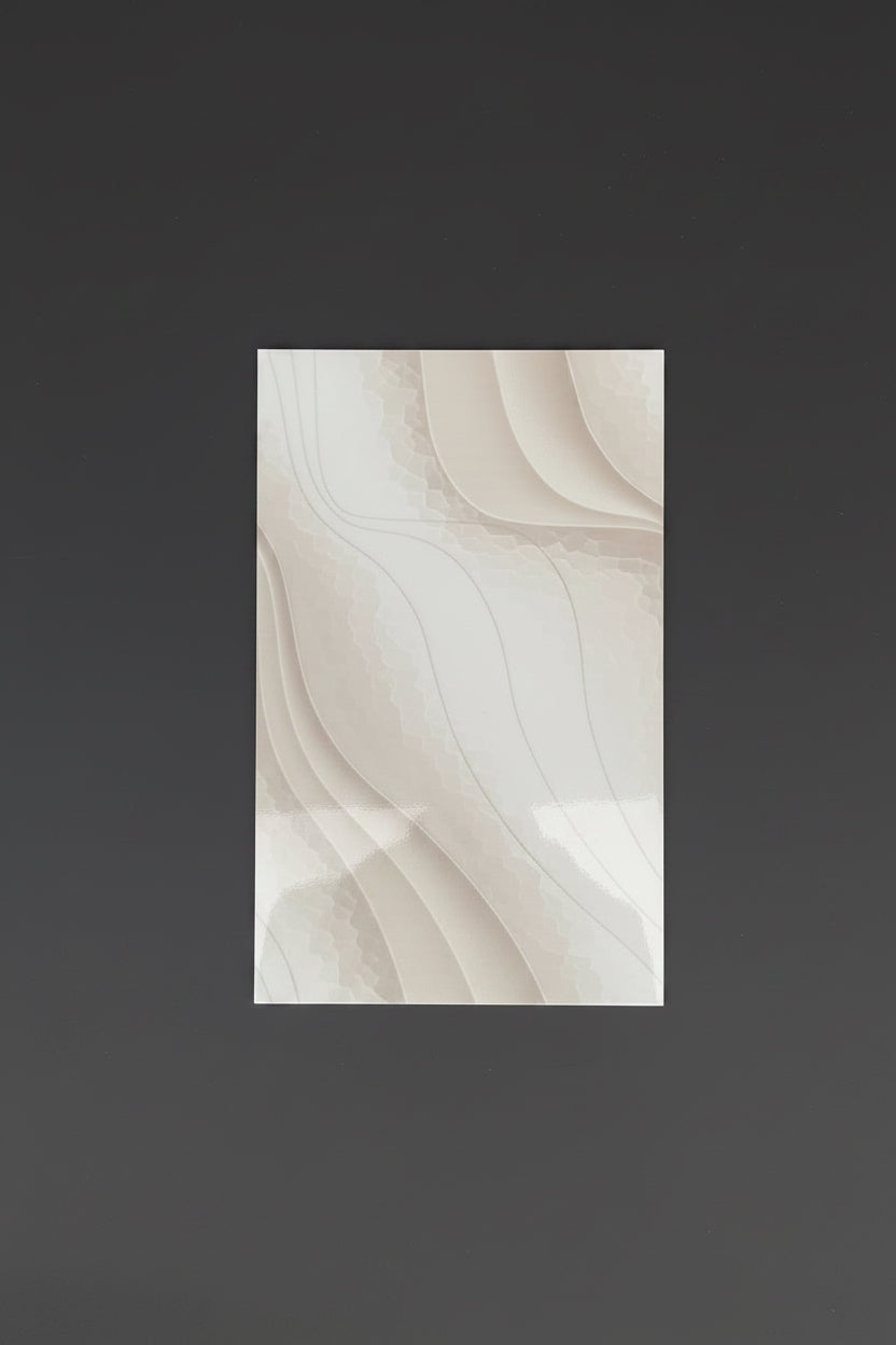 A rectangular ceramic tile with an abstract, layered wavy pattern in shades of cream, beige, and light taupe, centered on a dark gray background.