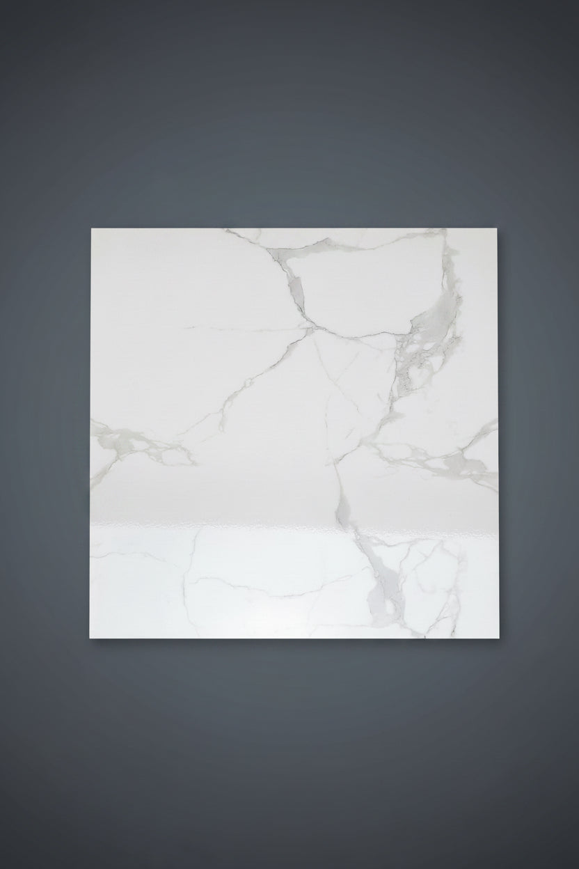 A large square white marble-patterned floor tile is shown on a beige tiled floor, with a smaller matching tile.