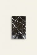 Black marble-look wall tile with white veining 25x40cm