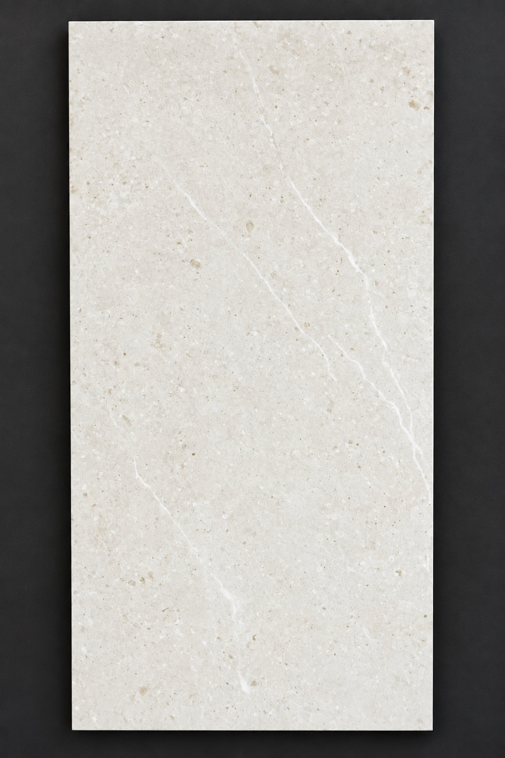 A rectangular ceramic or porcelain tile sample with a light beige/cream marble-like texture and subtle white veining, featuring the printed code '360009' in the top-left corner.