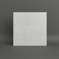 light gray textured tile or stone sample lies on a tan tiled floor 60x60cm roustic